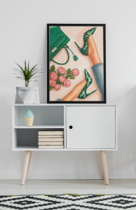 mockup-of-an-art-print-placed-on-a-minimalist-furniture-with-a-plant-38693-r-el2 (1).png
